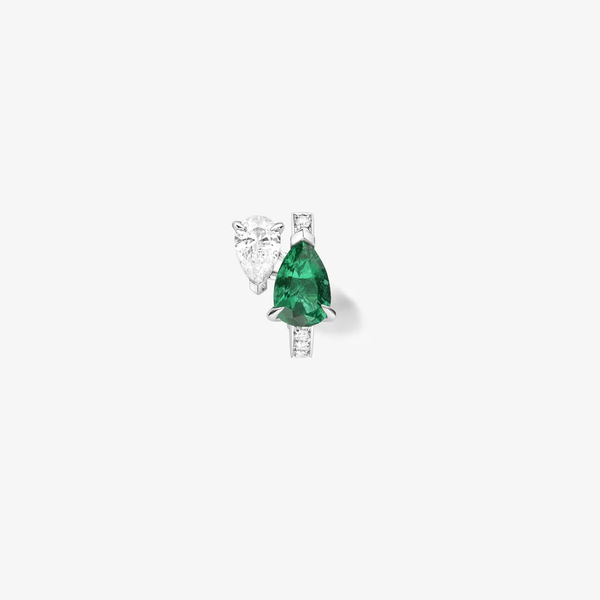 Serti sur Vide earring set with 1 diamond and 1 emerald