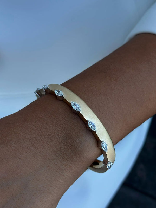 Gold Bangle Bracelet with Sparkling Gemstones – Timeless Elegance